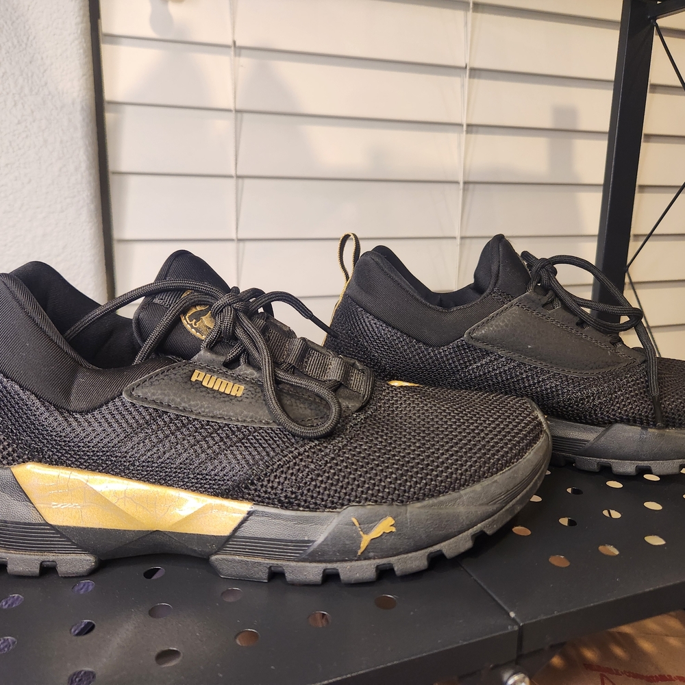 Puma Black and Gold Athletic Shoes